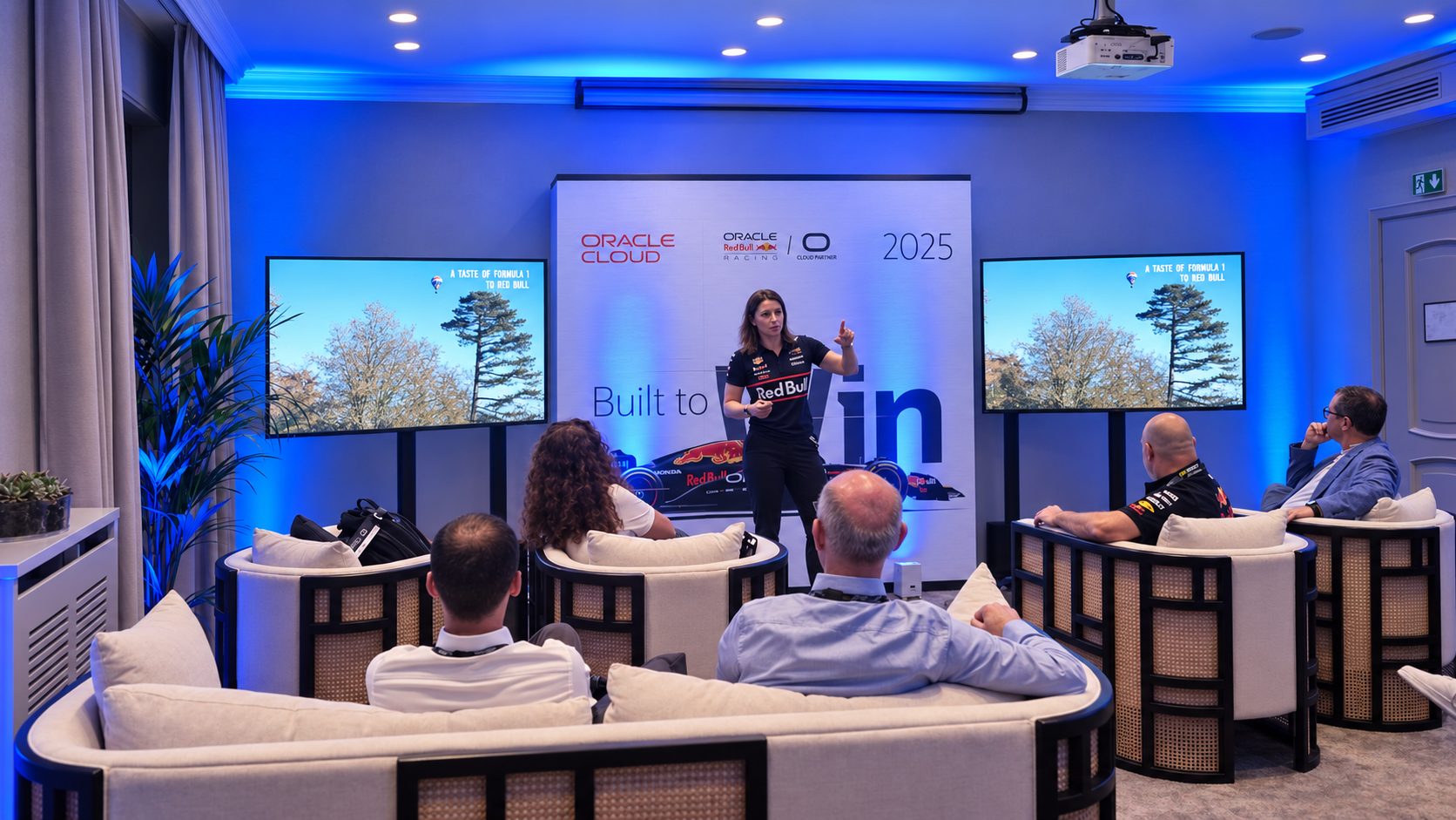On-stage talk with screens and blue lighting