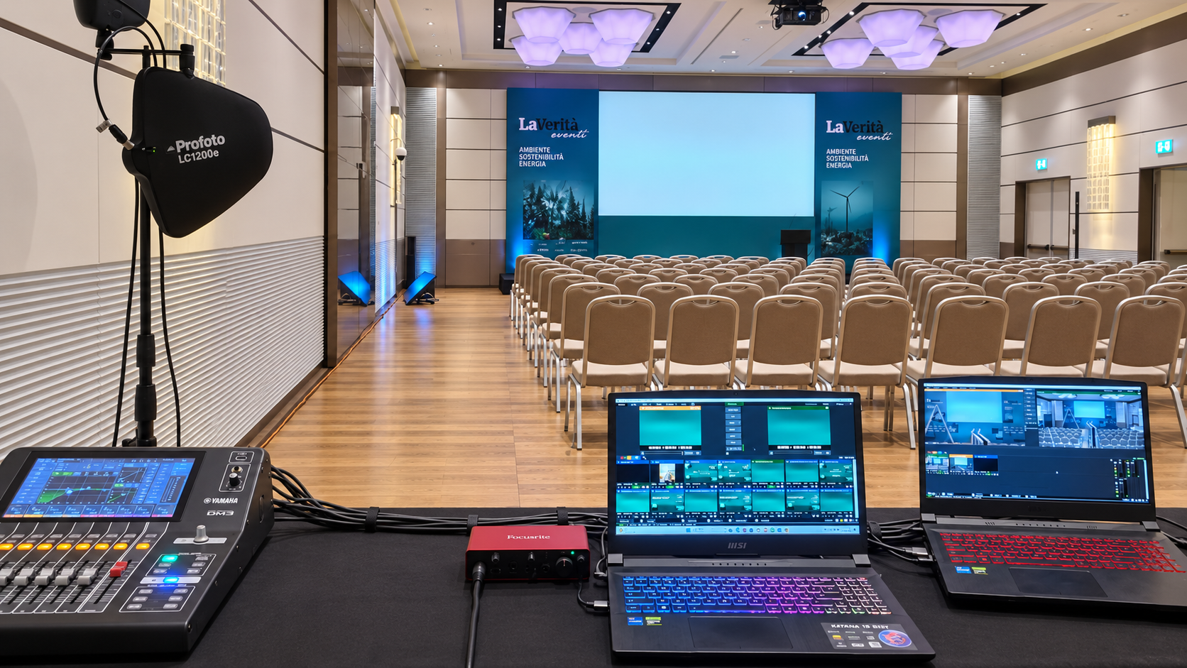 Conference room set up with control desk and projectors