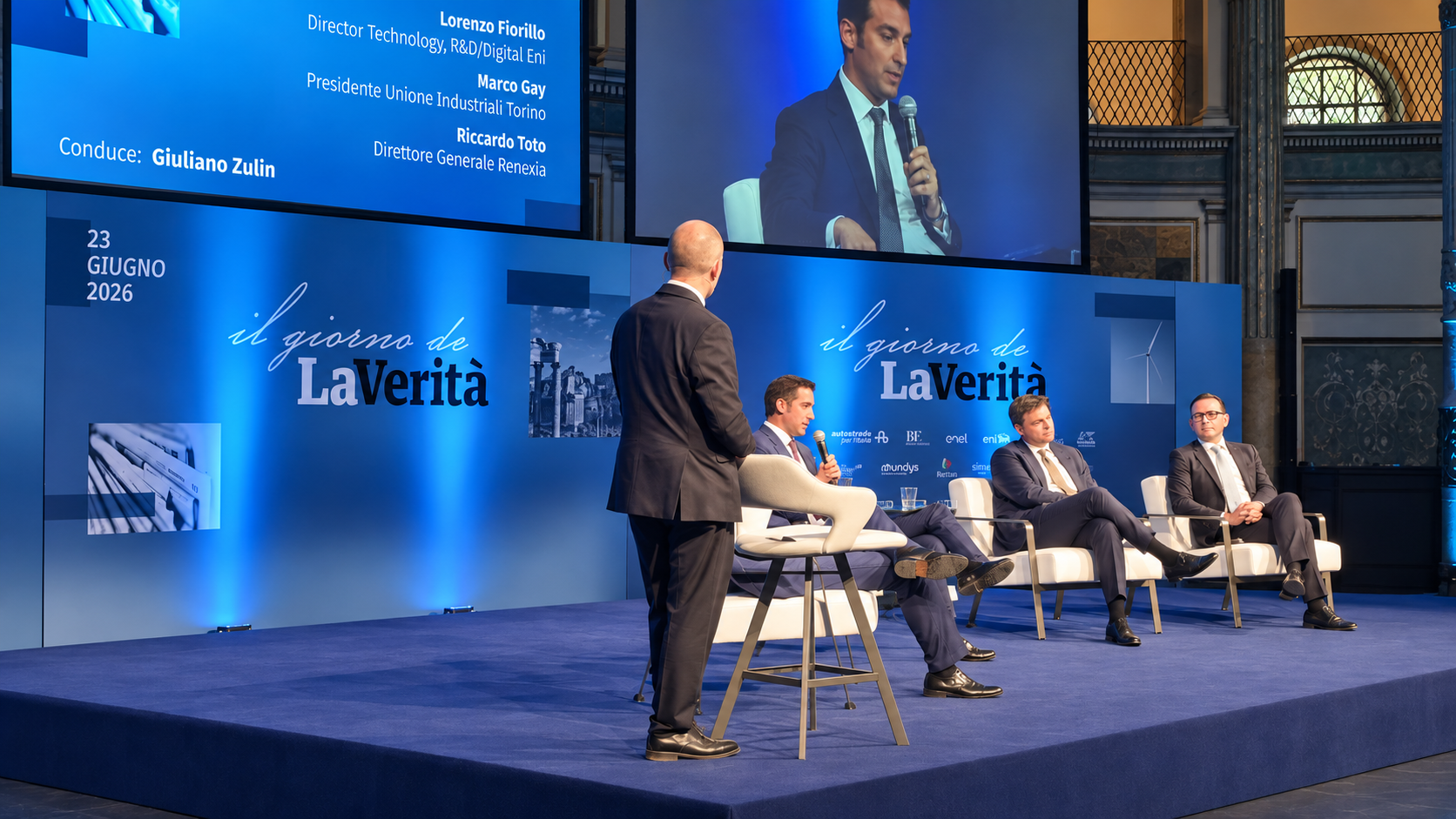 Panel on stage at a La Verità event
